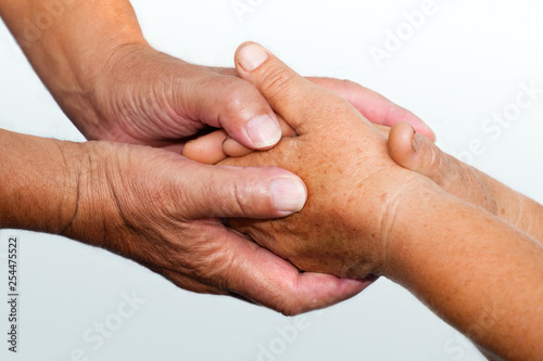 senior couple holding hands close up, helping hands