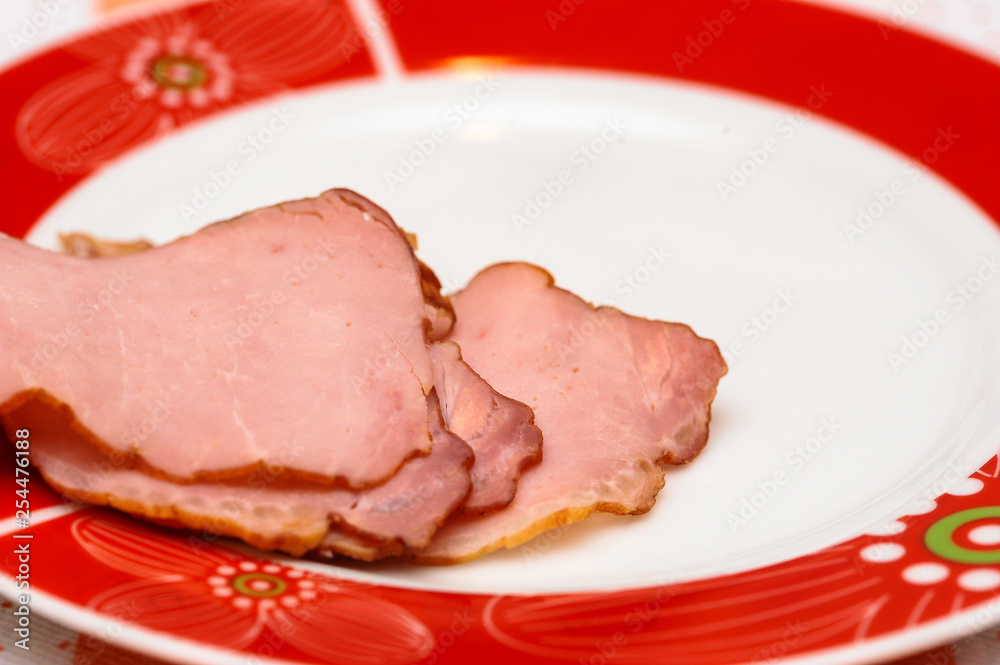 Plate with tasty sliced baked ham on table Plate with tasty sliced baked ham on table