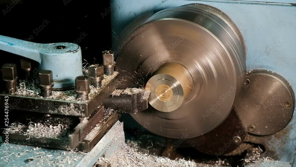Lathe in action. Processing brass billet slow motion Lathe in action. Processing brass billet slow motion