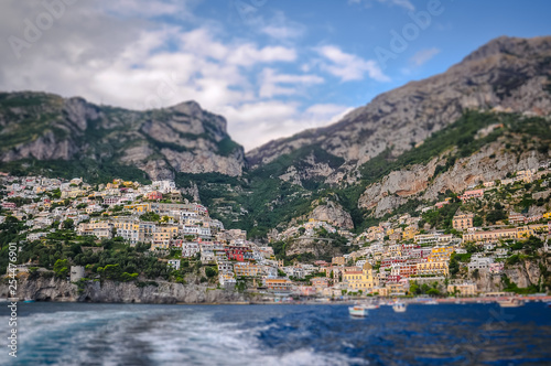 Positano village panorama from sea tilt shift effect