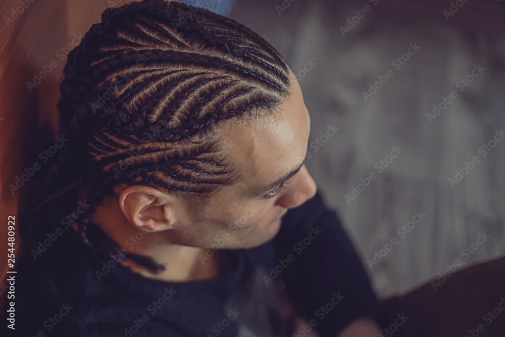 men's braids male braids close-up, hair drawing, creative hairstyle,  background, hair, a man looks into the distance Stock Photo | Adobe Stock