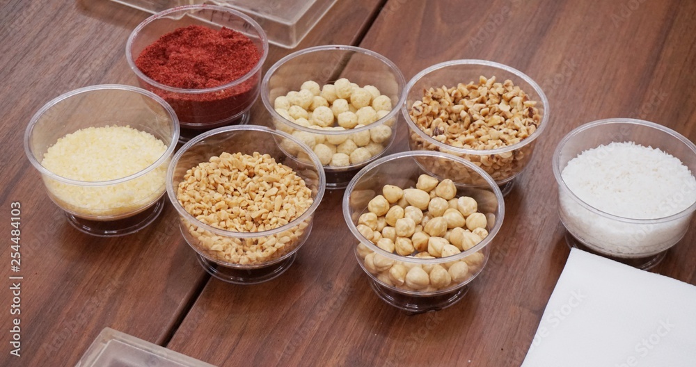 Various spices, nuts and additives on the table.