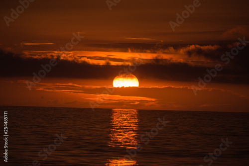 Dramatic clouded red and black sunset 