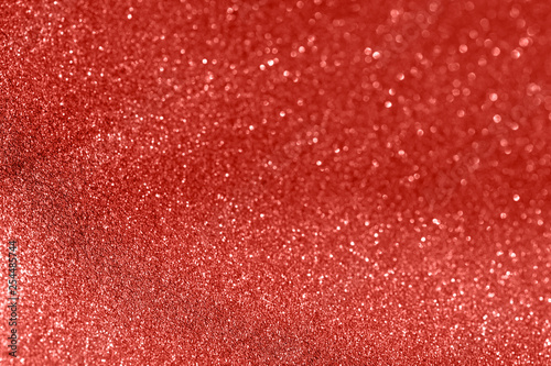 Red glitter texture christmas abstract background. Shiny wrapping paper texture, greeting card design element.