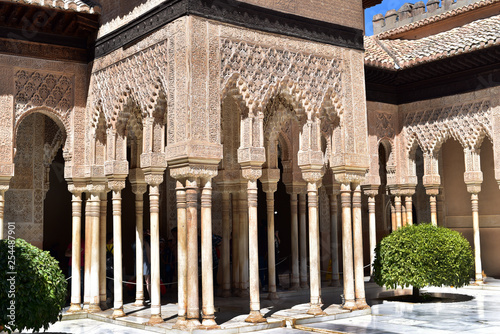 Carved columns in an interior courtyard named Court of the Lions inside La Alhambra in Granada  Spain