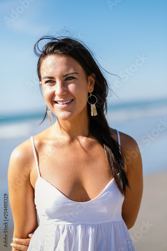 Beautiful young woman at the beach