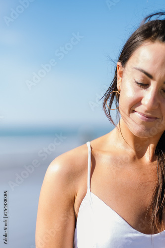 Beautiful young woman at the beach © Haley