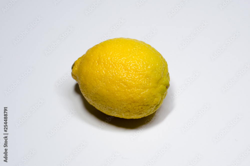 Juicy yellow lemon on a white background Juicy yellow lemon on a white background