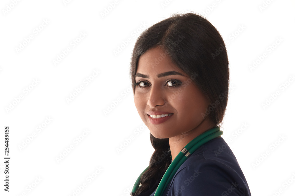 Beautiful brunette doctor in a blue robe isolated on white Beautiful brunette doctor in a blue robe isolated on white