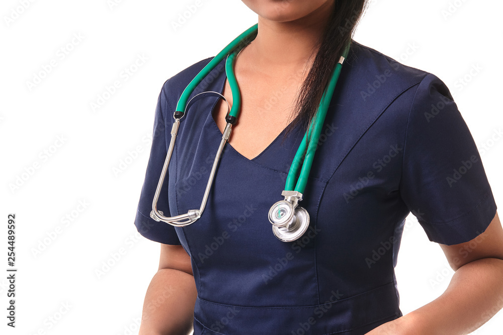 Beautiful young doctor with a stethoscope, isolated on white Beautiful young doctor with a stethoscope, isolated on white