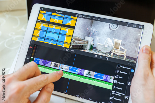 White plane in hand. On-screen video editing program