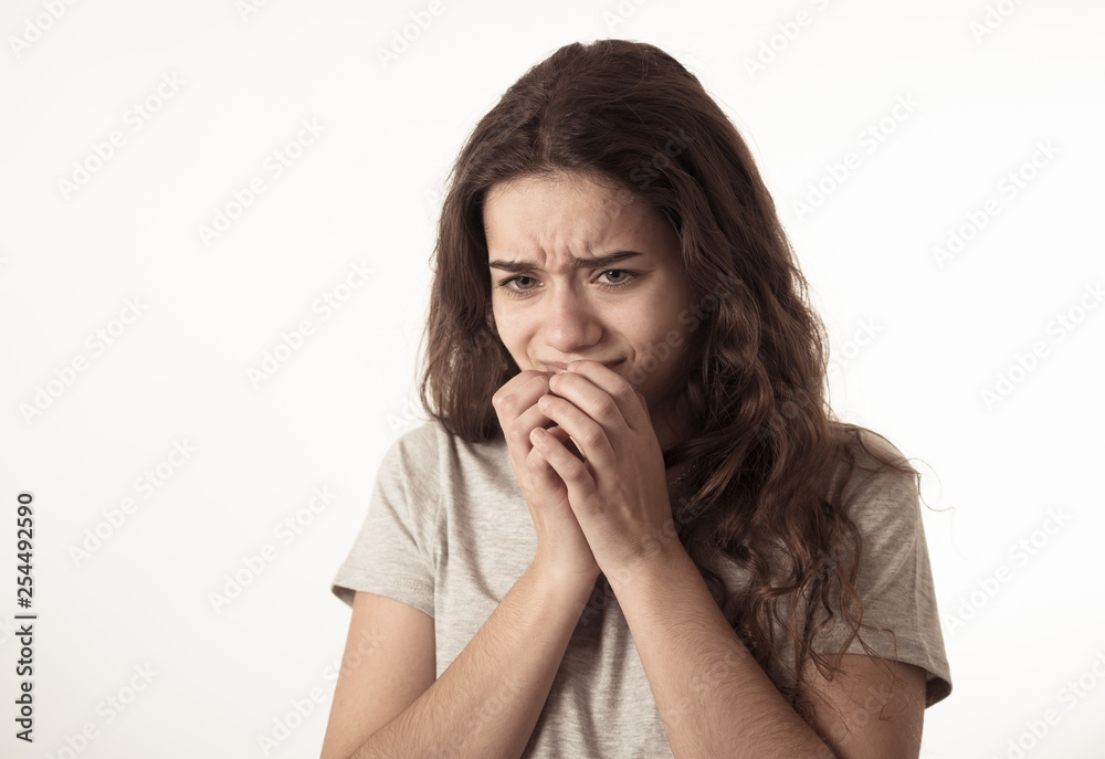 Human expressions and emotions. Young attractive teenager girl looking scared and shocked