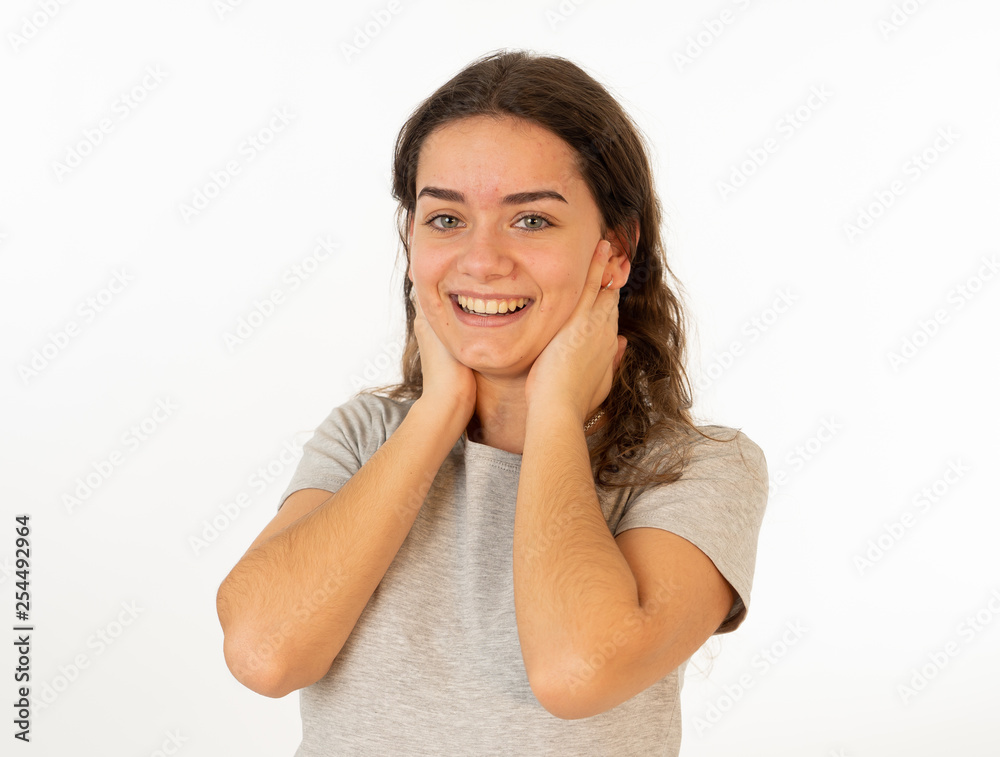 Human expressions and emotions. Portrait of young attractive girl smiling with surprised happy face Human expressions and emotions. Portrait of young attractive girl smiling with surprised happy face