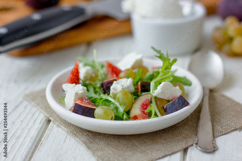 Beautiful vegetarian salad with goat cheese and figs. Beautiful vegetarian salad with goat cheese and figs.
