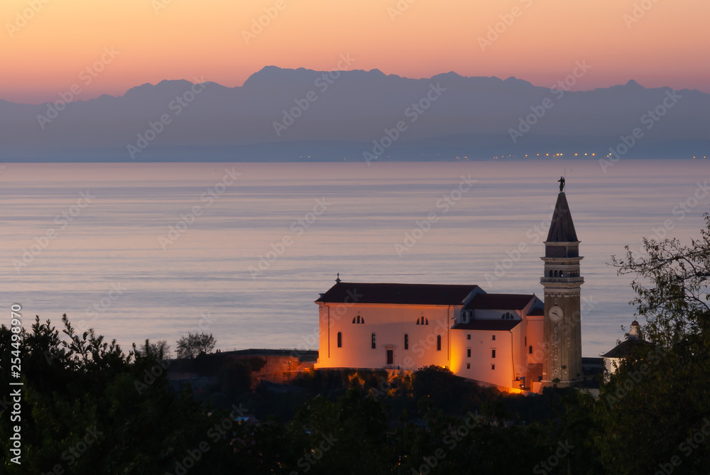 Piran in Slovenia with a beautiful red sunset 