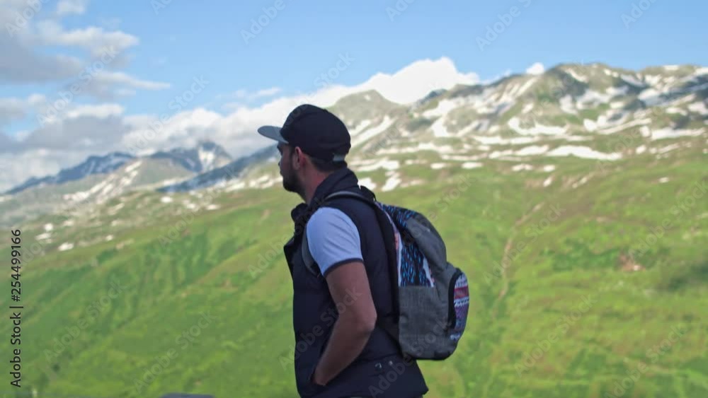 A tourist from Russia admires the greatness of the Alps. A tourist from Russia admires the greatness of the Alps.