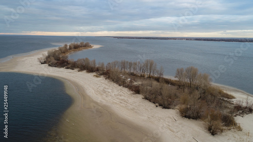 small island d in river with lot of bolds trees 