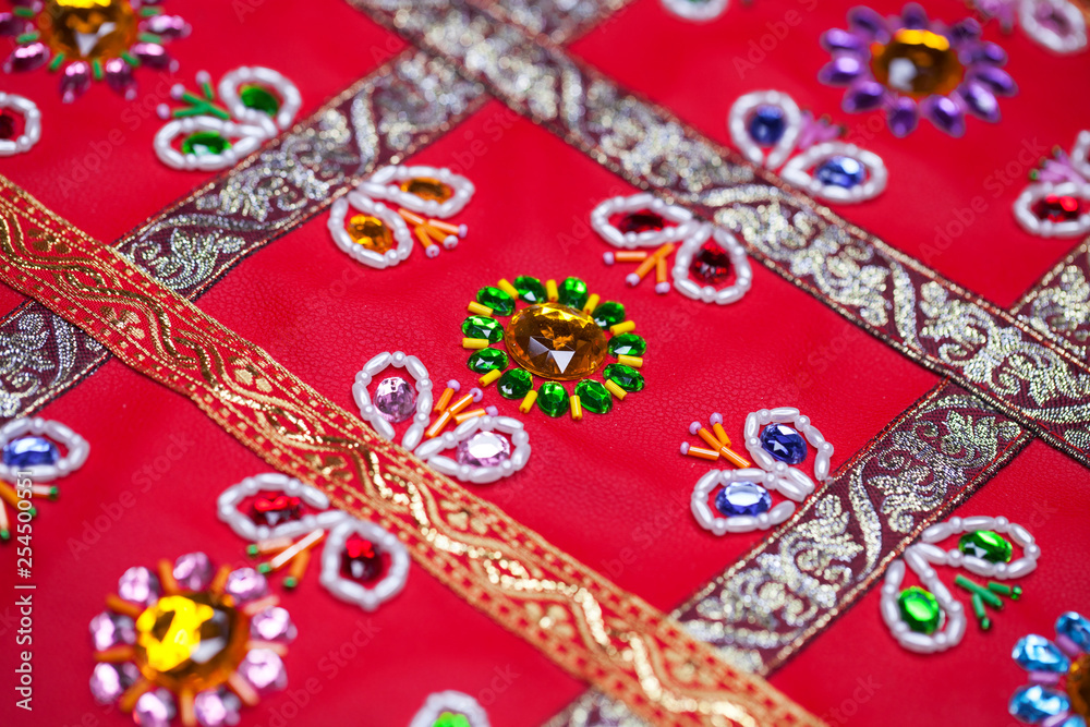 Embroidery on red leather Embroidery on red leather