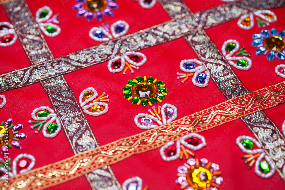Embroidery on red leather Embroidery on red leather