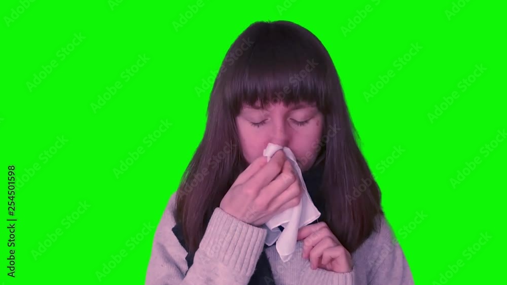 Young millennial girl caught cold on green screen Young millennial girl caught cold on green screen