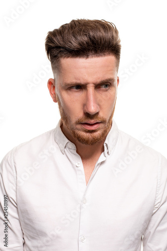 Studio photo of a good-looking man in a white shirt, isolated over a white background