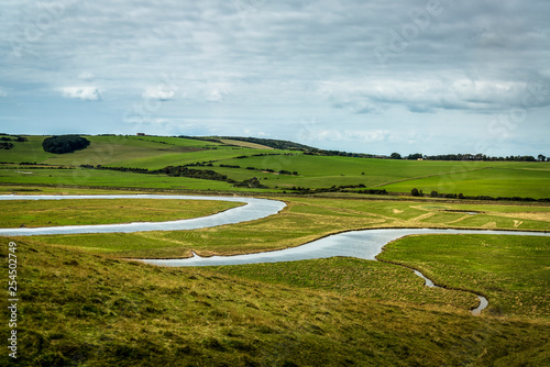 Cuckmere Haven, a meandering river forming several oxbow lakes, between Seaford and Eastbourne, East Sussex, England, UK photo