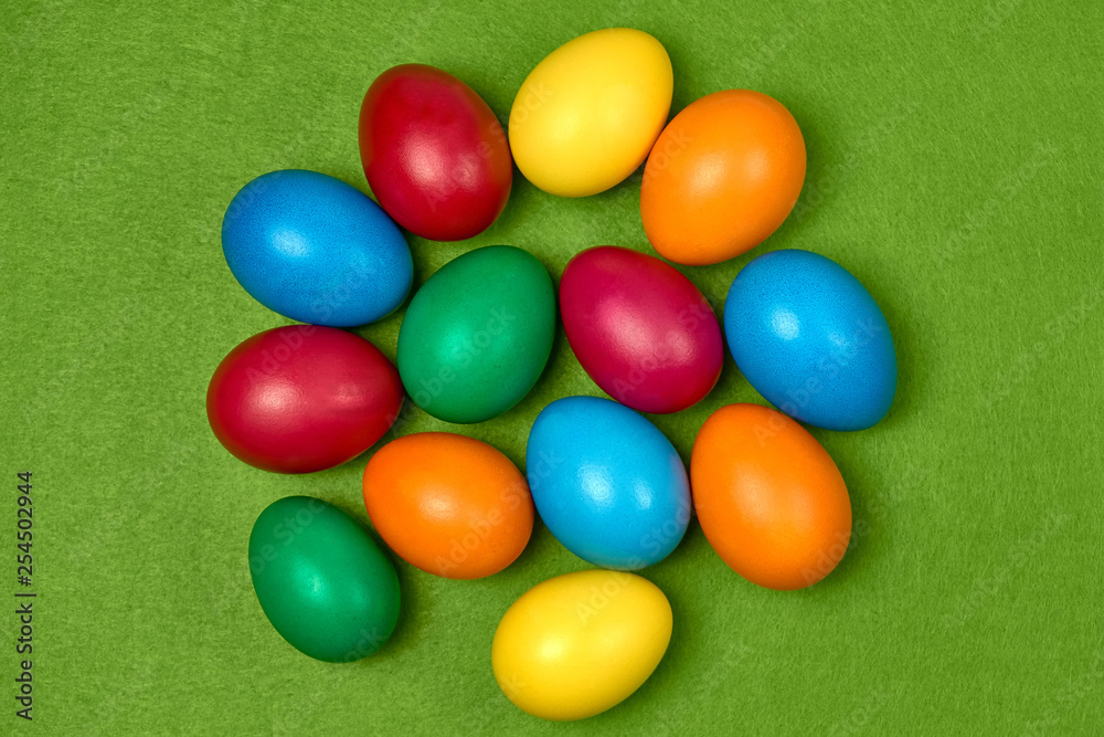 Easter eggs multicolored on green background Top view Easter eggs multicolored on green background Top view