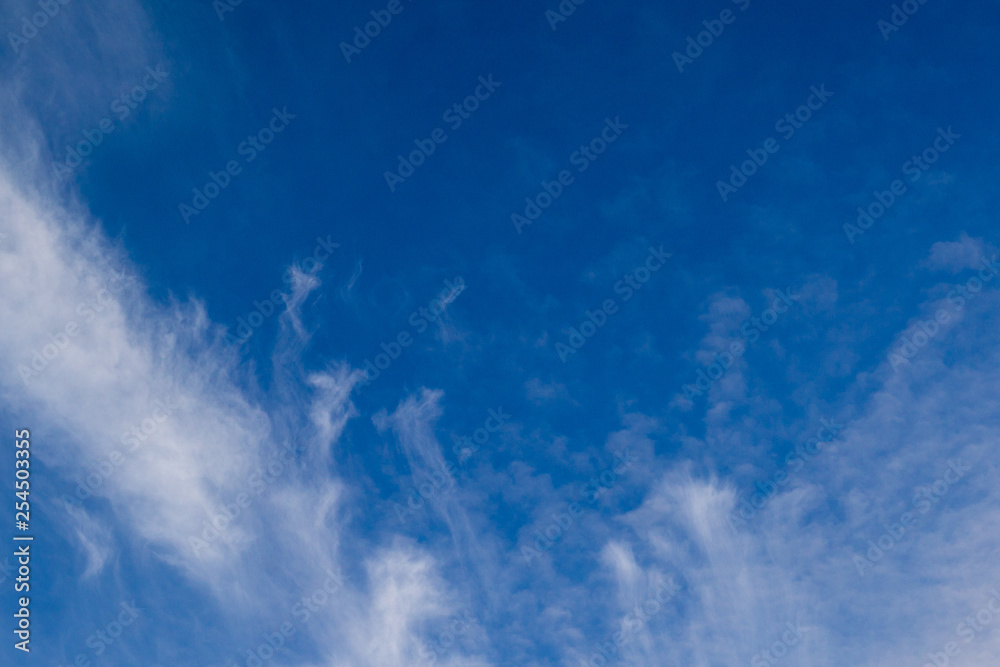 Blue sky with clouds and sun reflection in water with place for your text. blue sky background with white clouds Blue sky with clouds and sun reflection in water with place for your text. blue sky background with white clouds