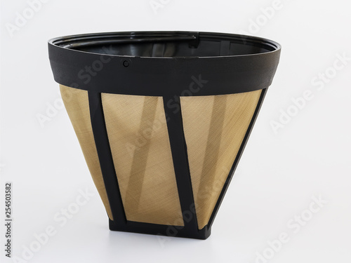 Reusable metal mesh coffee filter for drip coffee maker. Permanent basket coffee filter on white background. photo