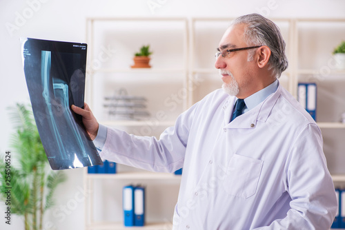 Wallpaper Mural Aged male doctor radiologist in the clinic  Torontodigital.ca