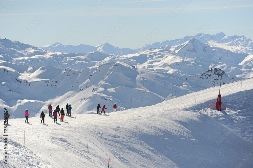 Group of skiers over a snowy mountain