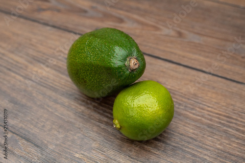 Avocado and Lime on a Wooden Table