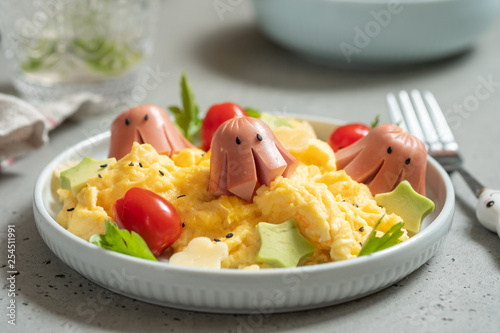 Octopus sausage with scrambled eggs served for kid breakfast