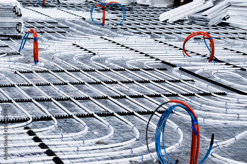 Underfloor heating  system with white pipes during construction
