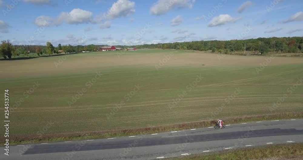 Man Cycling Road Bicycle in Sweden, Aerial Shot Man Cycling Road Bicycle in Sweden, Aerial Shot