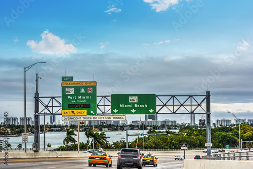 Driving on Mac Arthur causeway heading to Miami Beach on a cloudy day photo