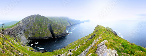 Panoramic view of the Kerry Cliffs of Portmagee on the Skellig Ring drive, Ring of Kerry, Ireland photo
