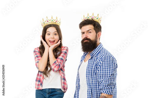 She is my little princess. Bearded man proud of his daughter. Man golden crown and little girl kid princess. Best daughter ever. Royal family. King and princess. Happy family white background photo