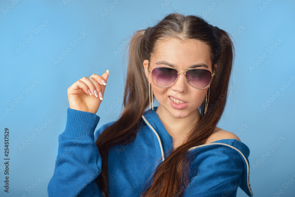 The girl in glasses and sports sweater in the style of the eighties The girl in glasses and sports sweater in the style of the eighties