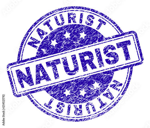 NATURIST stamp seal imprint with distress texture. Designed with rounded rectangles and circles. Blue vector rubber print of NATURIST title with dirty texture.