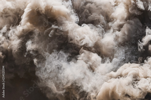 Pyrotechnic means for start-up smoke. Hand smoke grenade. Smoke bomb black. Gray smoke. The texture of the smoke. The area of the smoke. Fire. Pyrotechnics.