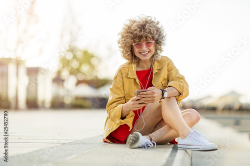 Young woman with mobile phone in the city