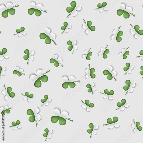 Green seamless pattern with white leaf clover design.