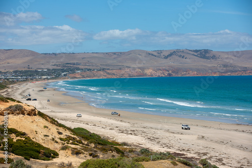 Fototapeta Naklejka Na Ścianę i Meble -  The beautiful Aldinga beach on clear sunny day with cars parked on the beach in South Australia on 14th February 2019