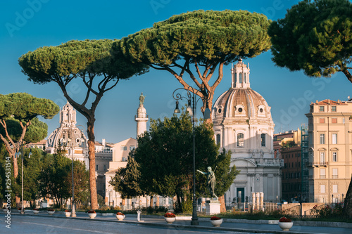 Rome, Italy. Via Dei Fori Imperiali Street In Sunny Summer Morning. View On Church Of Most Holy Name Of Mary At Trajan Forum