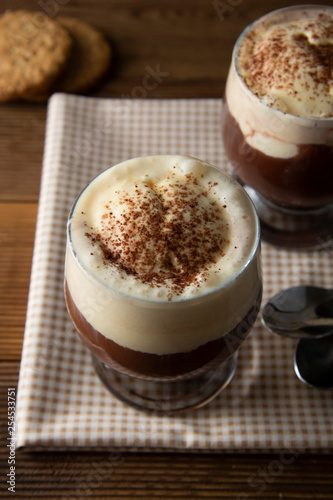 Coffee affogato with vanilla ice cream and espresso. Glass with coffee drink and icecream.