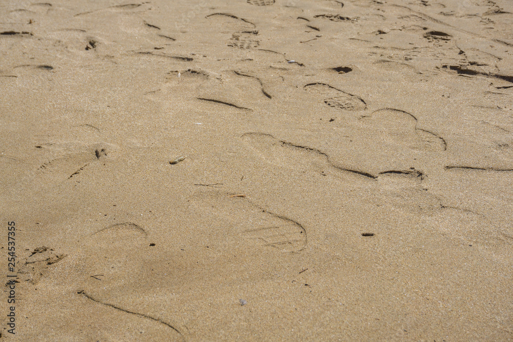 many footprints in the sea sand many footprints in the sea sand