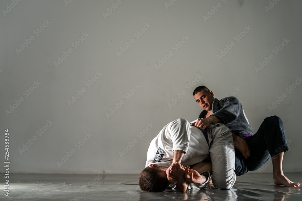 Brazilian Jiu Jitsu BJJ training sparring fight toe hold Stock Photo