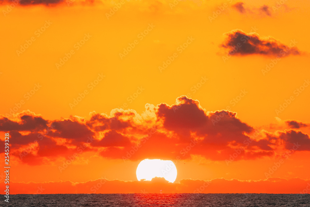 Sundown Over Sea Horizon At Sunset. Natural Sunrise Sky Warm Colors Over Ocean