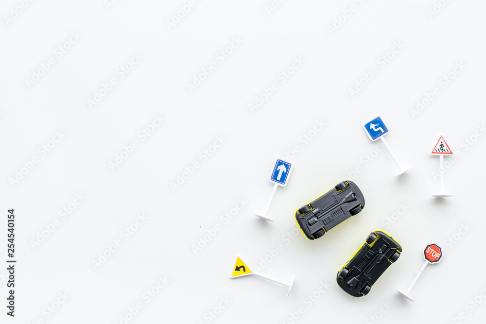 Car insurance concept with car toys on white background top view copyspace Car insurance concept with car toys on white background top view copyspace